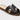 The Women’s Nina Slide Sandals by A New Day, crafted in black leather with an open toe and cutout design, feature a flat tan sole and minimalist style. These slip-on slide sandals evoke effortless charm and are showcased against a plain background.