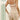 A model wears beige ATOG Women’s High-Waisted Tummy Control Shapewear Shorts, with callouts detailing the silicone bones, elastic waistband, and ventilated crotch of these thigh-smoothing shorts.