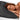 A woman sleeps peacefully on her side with eyes closed, resting her head and hands on an ADAMA Solid Satin Washable Pillowcase (26x22", Standard, Black Adult), covered by a white blanket to help reduce wrinkles.
