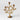The Gold Metal Botanical Candelabra by Threshold™ features a tree-inspired design with three branches, each adorned with detailed leaves and ending in flower-shaped taper candle holders—a stunning gold centerpiece perfect for any elegant setting.