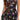 A woman models the Halcurt Women’s Ruffle Swimdress One Piece Swimsuit with Skirt – Floral by Halcurt, featuring a sleeveless design with adjustable shoulder straps, a fitted bodice, and a flared tiered skirt in a colorful floral print. Her long wavy hair is worn loose over one shoulder against a plain white background.