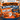 A promotional sale graphic for The Frugaling Shop Halloween Blowout Sale, featuring large orange and navy text over a Halloween-themed scene with pumpkins, a ghost, candles, bats, and spiderweb decorations.