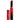 A Maybelline Color Sensational Ultimatte Slim Lipstick Makeup in More Ruby by L'Oréal stands upright, its red and black matte tube labeled "ULTIMATTE" with the cap off beside it, displaying the angled red lipstick inside.