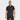 A man stands facing forward, smiling, wearing the Men's Short Sleeve Resort T-Shirt by All In Motion in black and black pants against a plain white background.