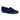 A pair of Nine West Women’s Renold Velvet Slip-On Loafers in medium blue, featuring a low black heel, rounded toe, and black trim around the opening, is displayed on a plain white background.