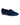 A pair of Nine West Women’s Renold Velvet Slip-On Loafers in medium blue, featuring a low black heel, rounded toe, and black trim around the opening, is displayed on a plain white background.