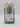 A Fresh Herb Storage Container - Large Green from Bullseye’s Playground™, made of clear and green plastic, features herb illustrations and usage instructions on the front label; priced at $5. These details help categorize the product easily in your kitchen or store.