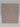 A square object with a pinkish-tan color, similar to the U Brands Urban Botanical 1″ 3-Ring Binder with Pockets - Geometric, featuring a repeating geometric pattern of white, rounded rectangles and ovals. The background is plain white.