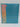 A Yoobi 1″ D-Ring Binder with 2 Interior Pockets in teal, featuring a sturdy design and a pastel label indicating its 220-sheet capacity, stands upright on a plain, light background.