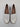 A New Day’s Women’s Archie Loafer Flats feature a white faux leather upper with a classic penny slot detail, set on a chunky light brown sole with a low heel. Designed for all-day comfort, these loafers include memory foam insoles.