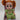 The Disney Frozen II Young Anna Doll features vibrant red hair styled in pigtails and a charming green dress, presented in packaging with Anna’s image and the Frozen II logo—a delightful adventure toy perfect for fans of all ages.