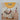The Mondo Llama Resin Bag Charms Craft Kit 4pc, by Mondo Llama, is shown in its packaging featuring a cream tote bag adorned with vibrant, personalized resin accessories and a water bottle with a keychain. The kit is designed for ages 14+ and displays safety warnings on the box.