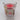 A Wondershop Gel LED Santa Hat Candle in the Winter Carnivale scent sits in a clear glass holder adorned with festive decorations and a product tag on the front, making it an ideal holiday gift or cheerful addition to your Christmas décor.