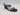 Black The Drop Women’s Sophia Wedge Sandals with a square-toe, two thin straps over the foot, and a beige footbed.