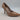The Drop Parish Pointed Toe High Heel Pumps in a beige patent finish with a glossy pointed-toe style.