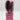 A Professional Quality 5-Piece Hair Brush Styling Set – Pink featuring a paddle brush, roller brush, mirror, cylinder, and hair clip inside a clear cylindrical display case.