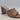 The Drop Pattie Quilted High Block-Heel Mule Sandals in black with a gold-tone accent on the heel.