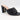 The Drop Pattie Quilted High Block-Heel Mule Sandals in black with a gold-tone accent on the heel.