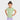 A young girl with dark hair in a top bun smiles with her hands on her hips, wearing the Cat & Jack Toddler Girls' Short Sleeve Solid T-Shirt in green and lavender leggings, standing against a plain white background.