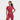 A woman in a JoyLab Women's Cropped Short Sleeve Shirt in burgundy stands against a plain white background, smiling to the side with one hand on her hip.