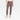 A person is shown from the waist down wearing A New Day Women’s High-Rise Skinny Ankle Pants in light brown, paired with cream loafers featuring gold bit detail, standing against a plain white background.