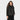 A woman with long brown hair wears the Universal Thread Women’s Long Sleeve Tie-Front Bow Blouse in black stripes, featuring metallic vertical stripes and a neck bow, standing against a white background and smiling—ideal for officewear.
