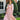 A woman wears a hat, sunglasses, and a beige Zesica Women’s Smocked Tiered Long Sleeve Midi Dress M, featuring long sleeves and a tiered skirt.